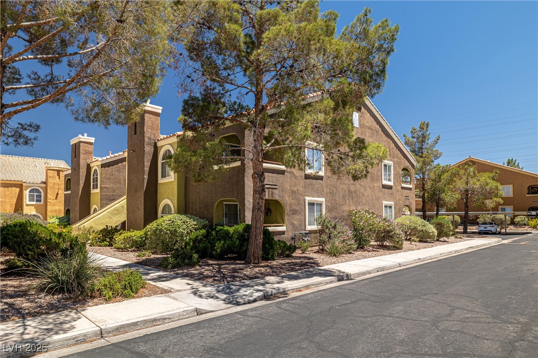 7950 West Flamingo Road, Unit 1024 Las Vegas, NV 89147 - Photo 29 of 30 View of front of home with stucco siding and a chi