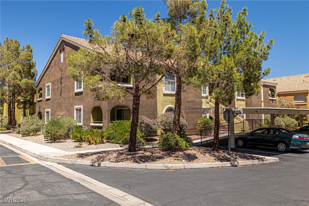 7950 West Flamingo Road, Unit 1024 Las Vegas, NV 89147 - Photo 30 of 30 View of front facade with stucco siding and covere