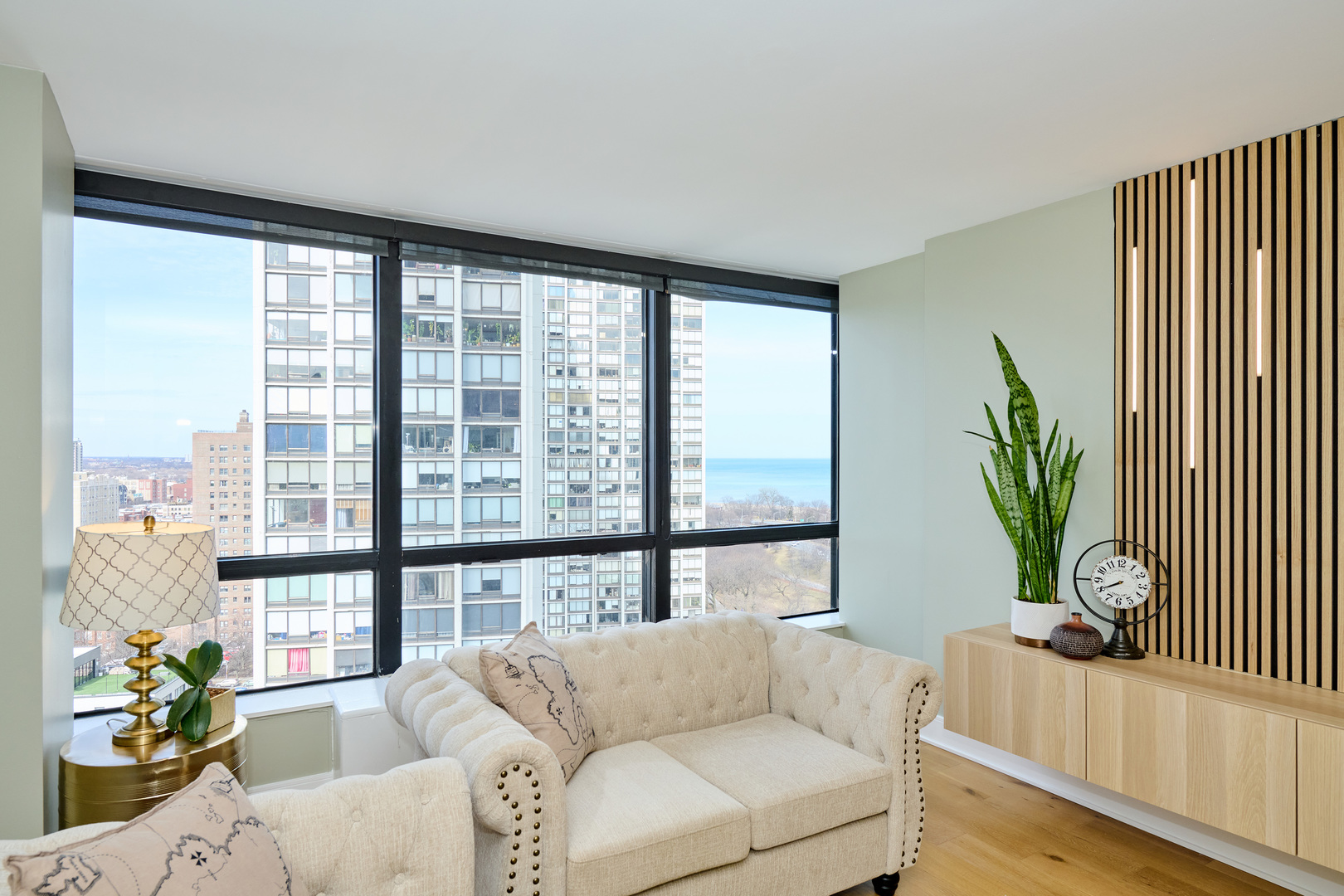 5415 North Sheridan Road, Unit 1908 Chicago, IL 60640 - Photo 11 of 45 a living room with furniture and a large window