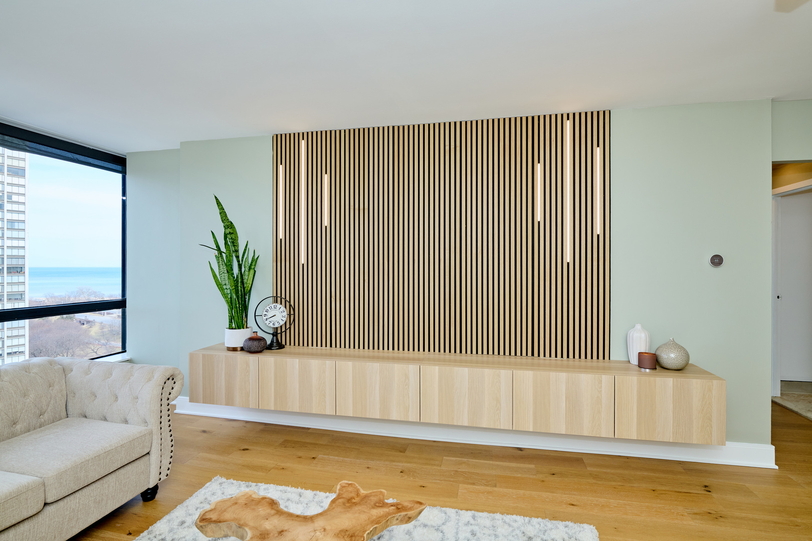 5415 North Sheridan Road, Unit 1908 Chicago, IL 60640 - Photo 12 of 45 a living room with furniture and a rug