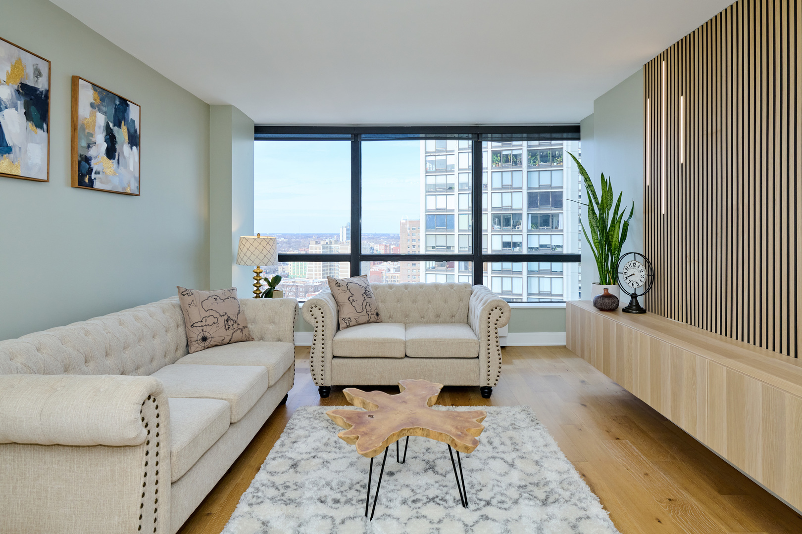 5415 North Sheridan Road, Unit 1908 Chicago, IL 60640 - Photo 13 of 45 a living room with furniture and a large window