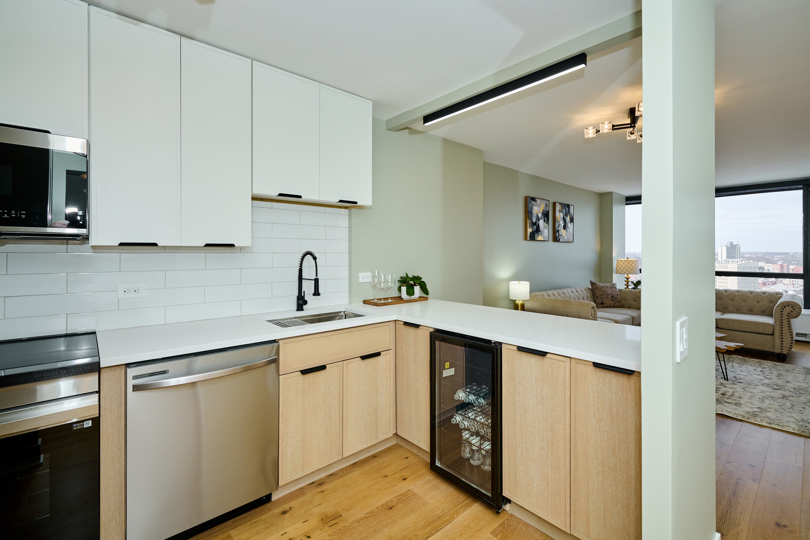5415 North Sheridan Road, Unit 1908 Chicago, IL 60640 - Photo 3 of 45 a kitchen with a sink cabinets and stainless steel appliances