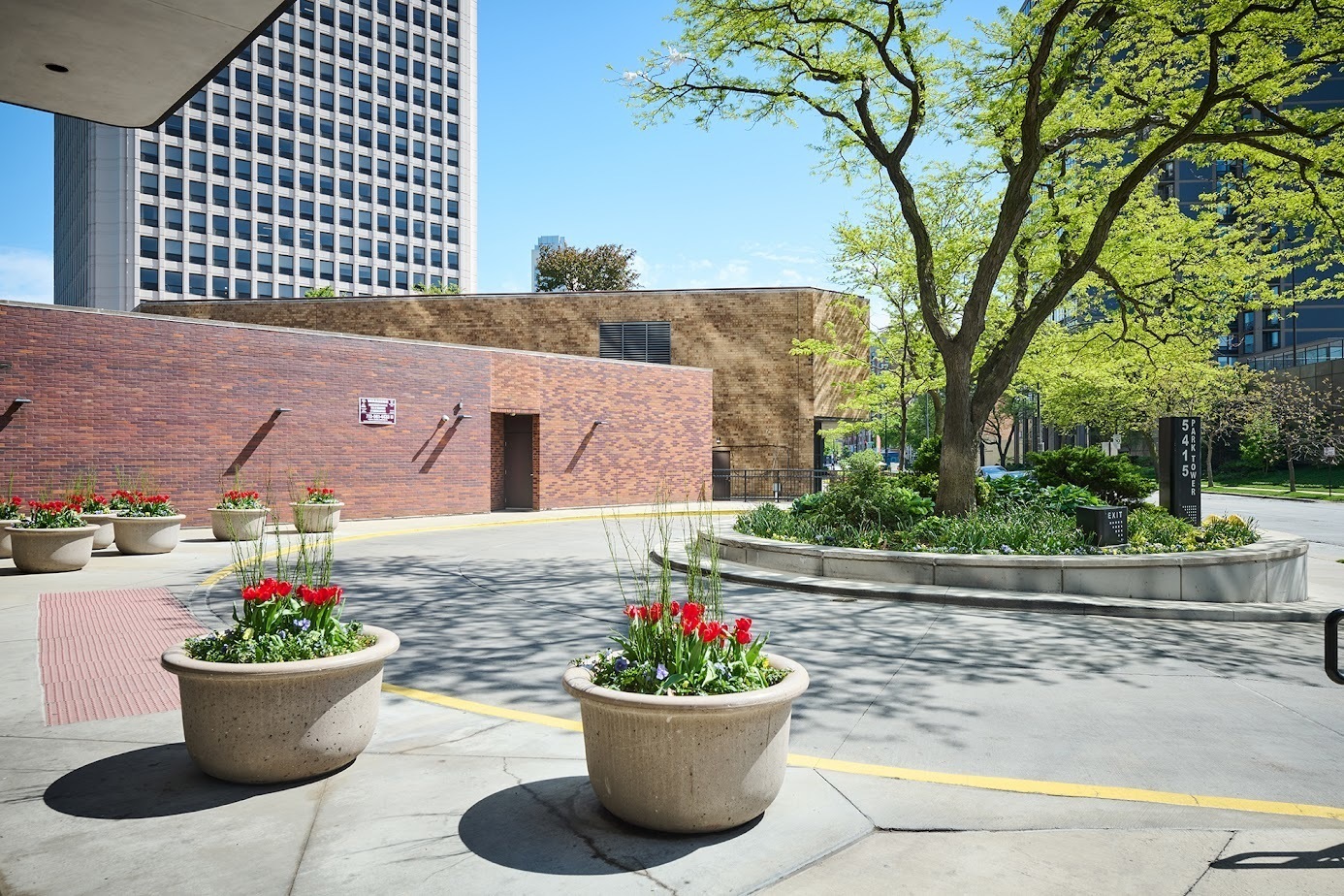 5415 North Sheridan Road, Unit 1908 Chicago, IL 60640 - Photo 45 of 45 a view of a patio with dining table and chairs and potted plants