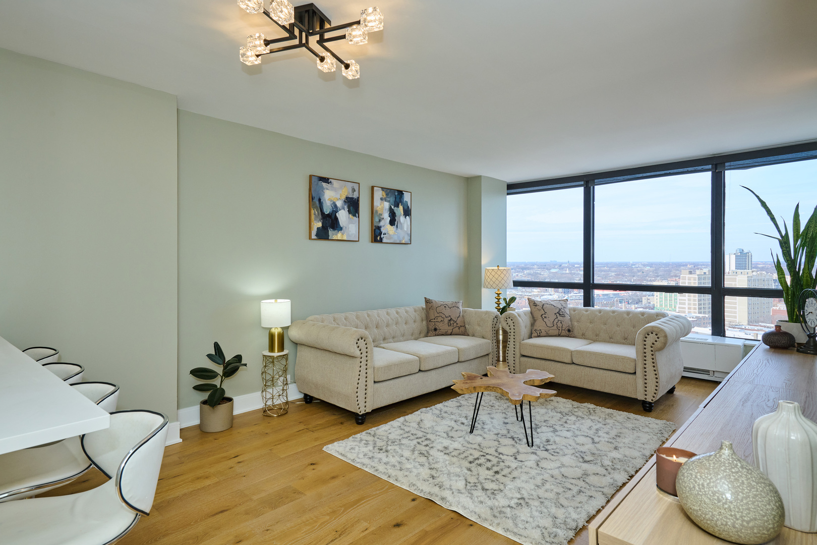 5415 North Sheridan Road, Unit 1908 Chicago, IL 60640 - Photo 6 of 45 a living room with furniture and a large window