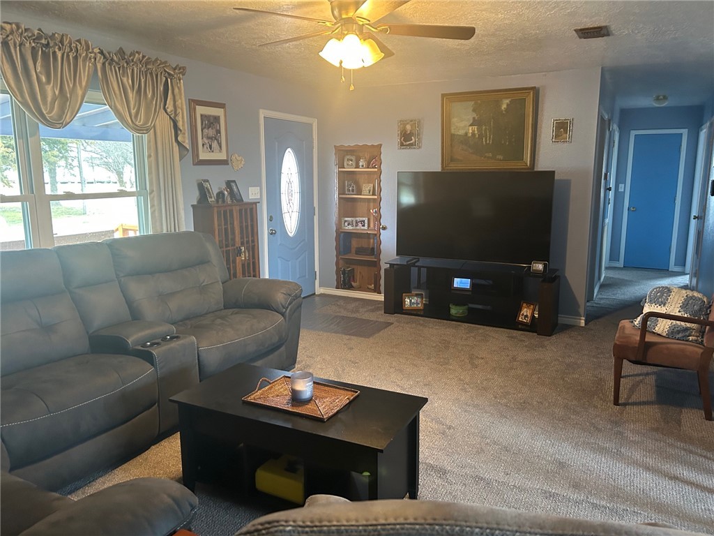 11525 4th Street North Zulch, TX 77872 - Photo 12 of 21 a living room with furniture and a flat screen tv