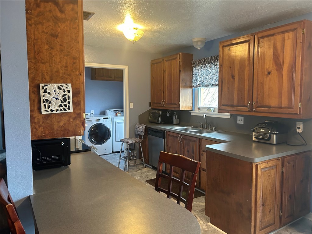 11525 4th Street North Zulch, TX 77872 - Photo 14 of 21 a kitchen with a sink and a stove top oven
