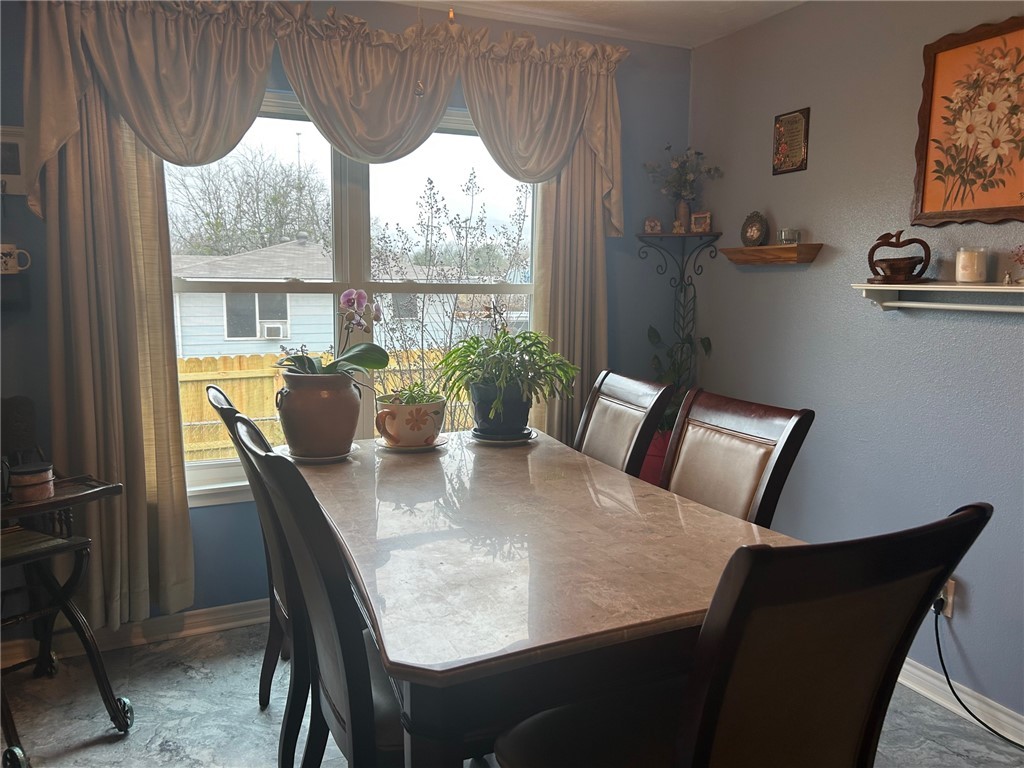 11525 4th Street North Zulch, TX 77872 - Photo 15 of 21 a view of a dining room with furniture window and outside view