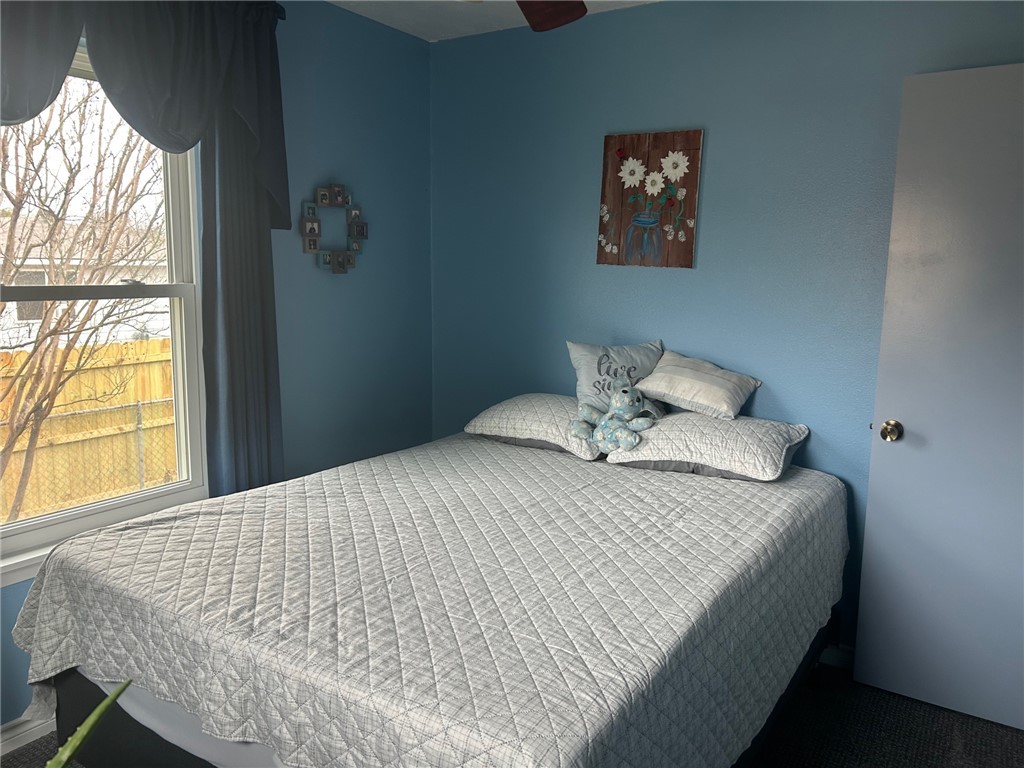 11525 4th Street North Zulch, TX 77872 - Photo 7 of 21 a bedroom with a bed and a window