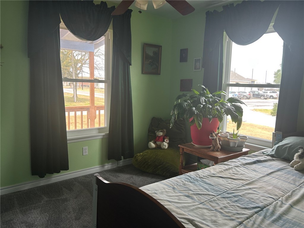 11525 4th Street North Zulch, TX 77872 - Photo 10 of 21 a bedroom with a bed window and table