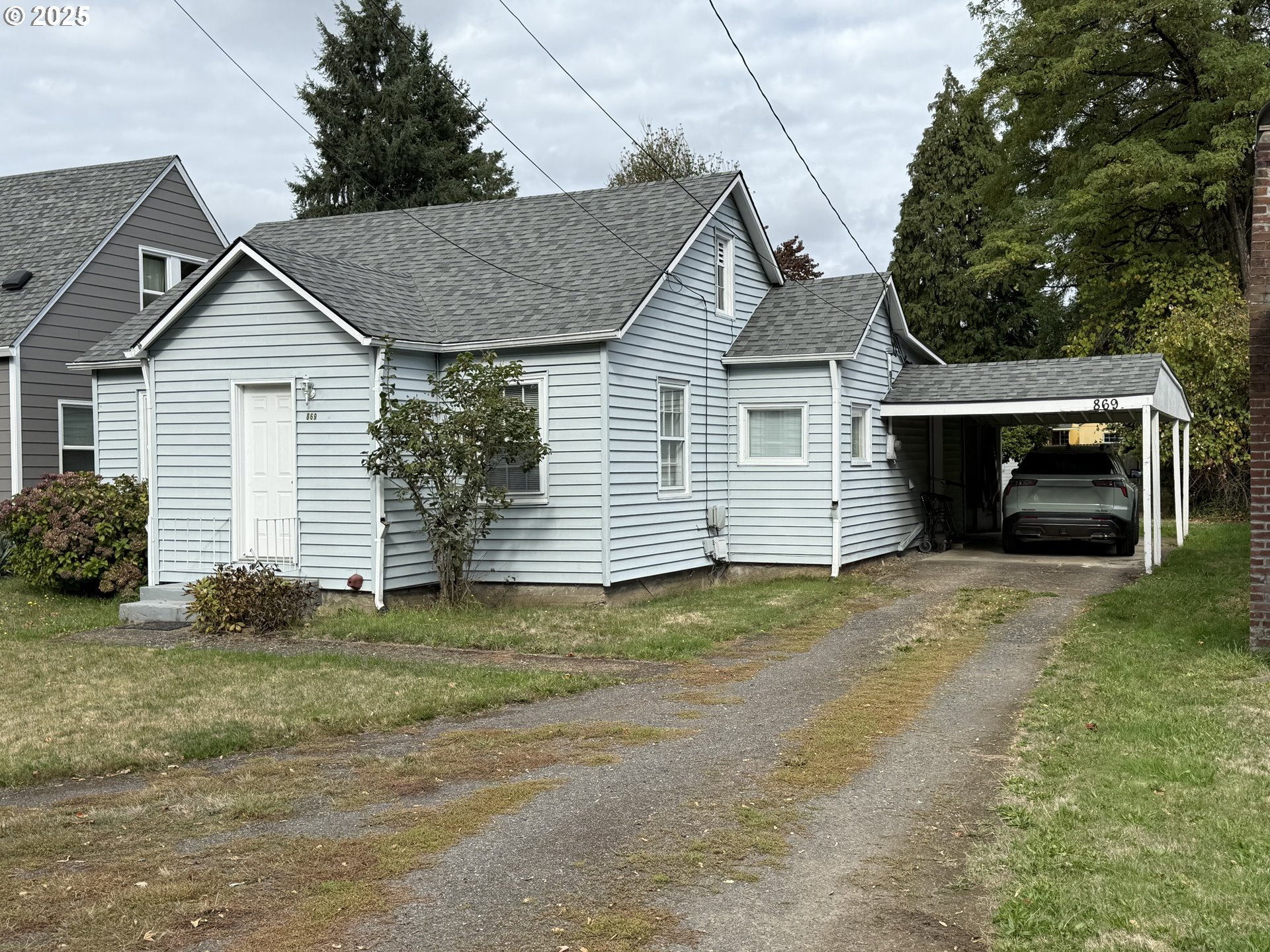 869 E Street Washougal, WA 98671 - Photo 3 of 14 a view of a house with a yard
