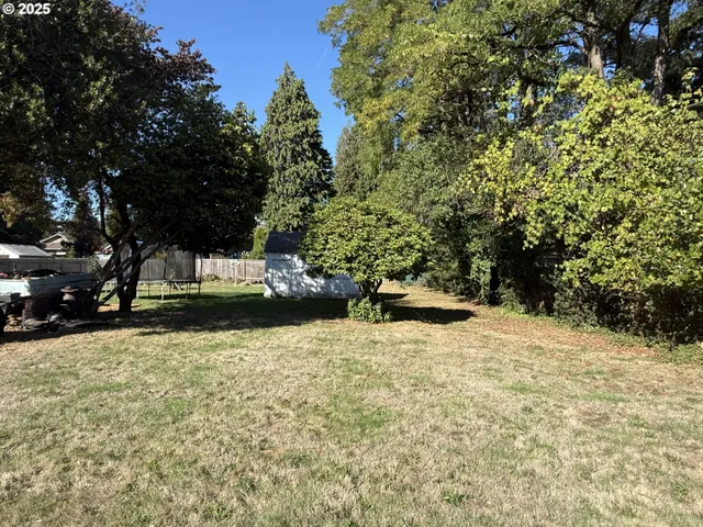 a view of swimming pool with a yard