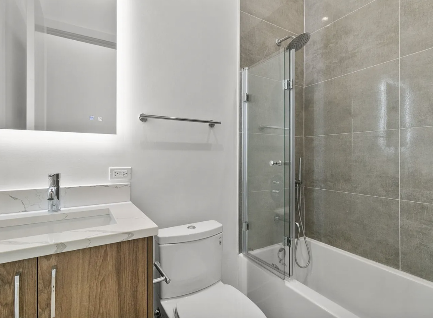 77 West Chestnut Street, Unit 2A Chicago, IL 60610 - Photo 11 of 13 a bathroom with a sink a toilet and shower