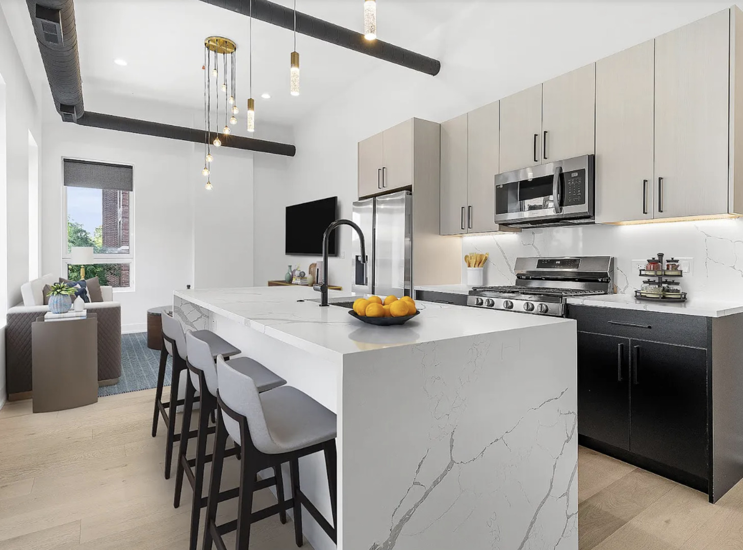 77 West Chestnut Street, Unit 2A Chicago, IL 60610 - Photo 2 of 13 a kitchen with stainless steel appliances a sink a stove a table and chairs