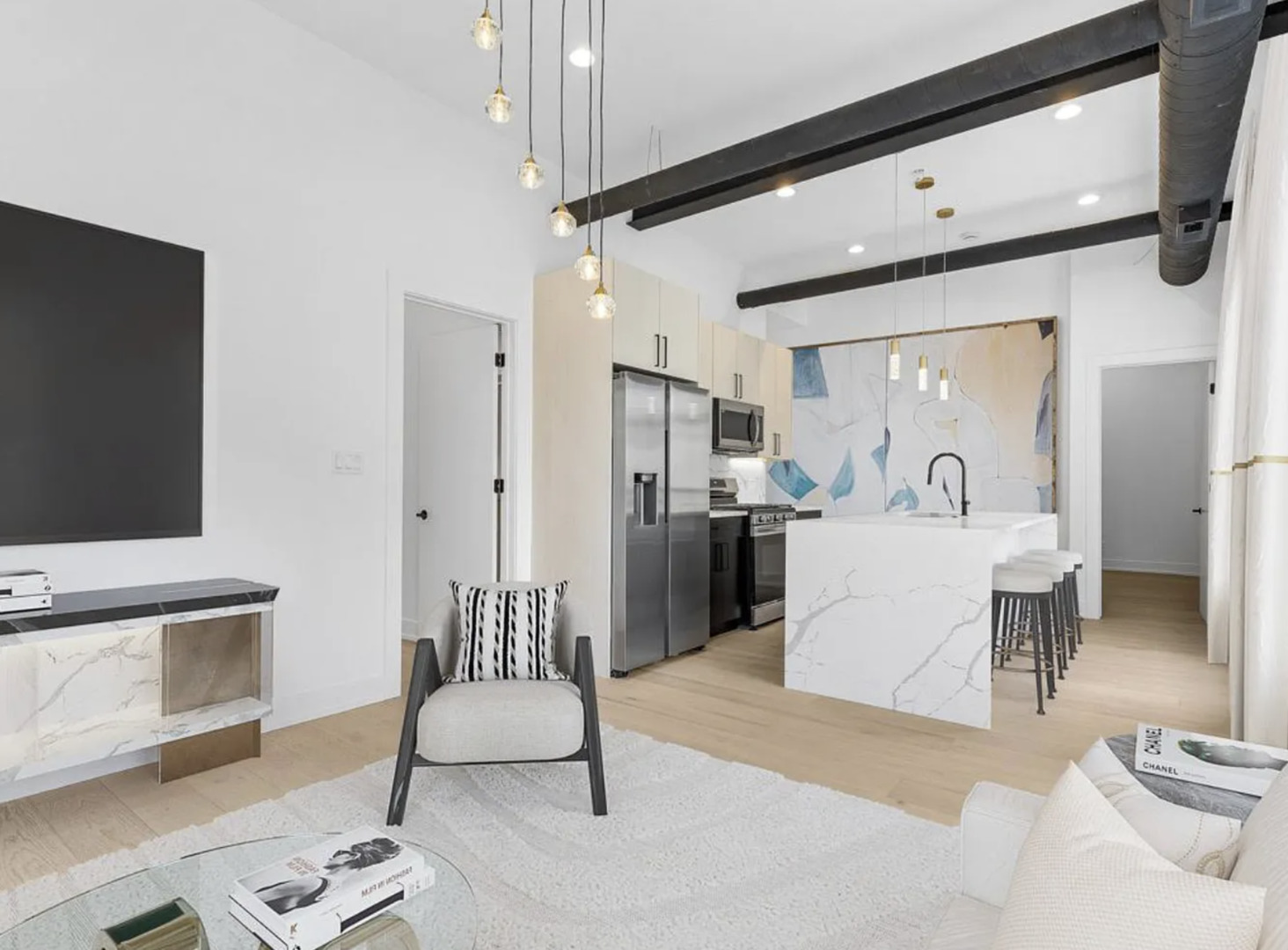 77 West Chestnut Street, Unit 2A Chicago, IL 60610 - Photo 3 of 13 a living room with furniture and a flat screen tv