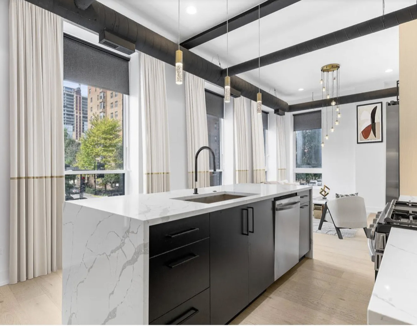 77 West Chestnut Street, Unit 2A Chicago, IL 60610 - Photo 4 of 13 a large white kitchen with a large window