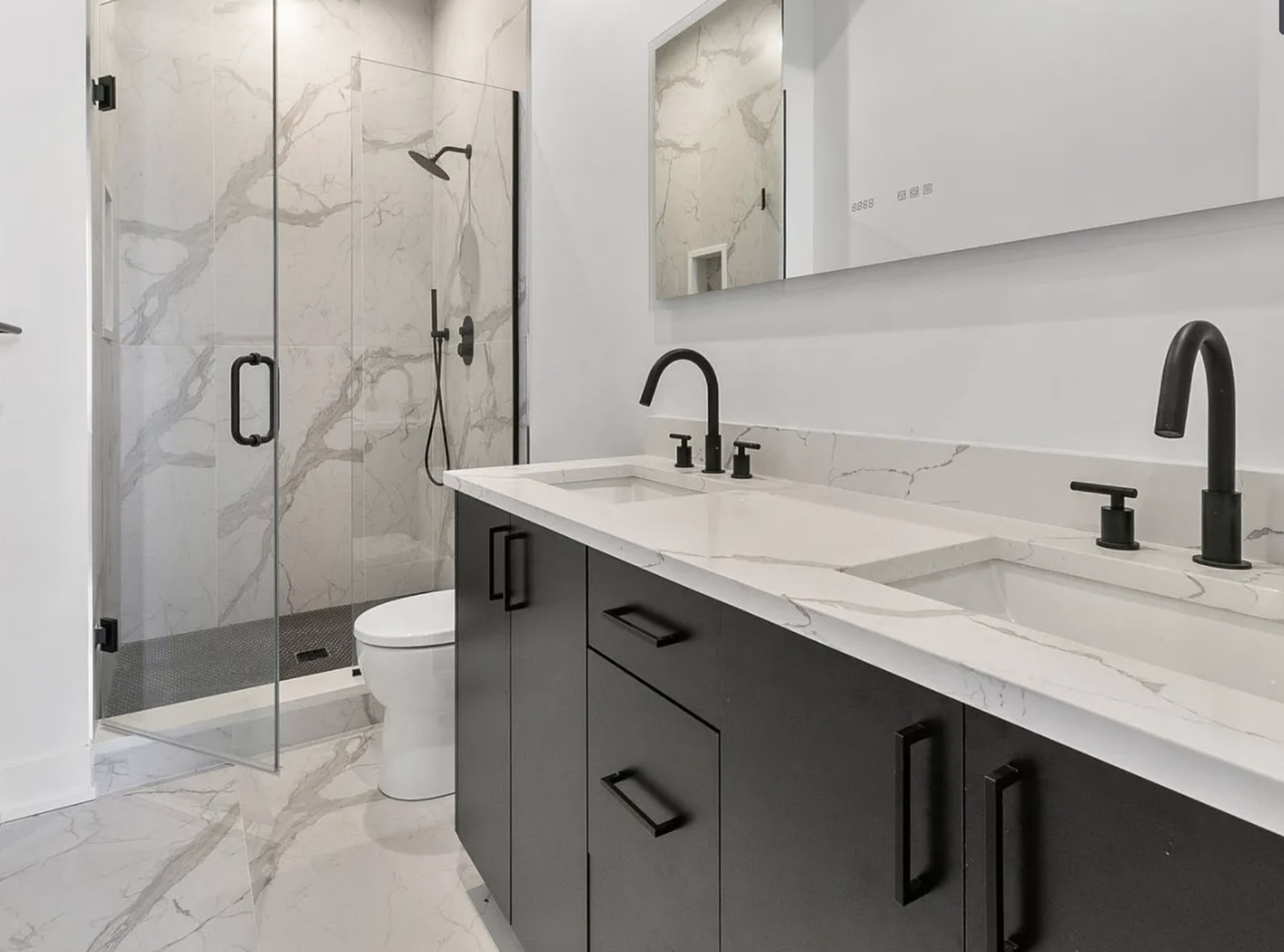 77 West Chestnut Street, Unit 2A Chicago, IL 60610 - Photo 9 of 13 a bathroom with a sink a toilet and shower