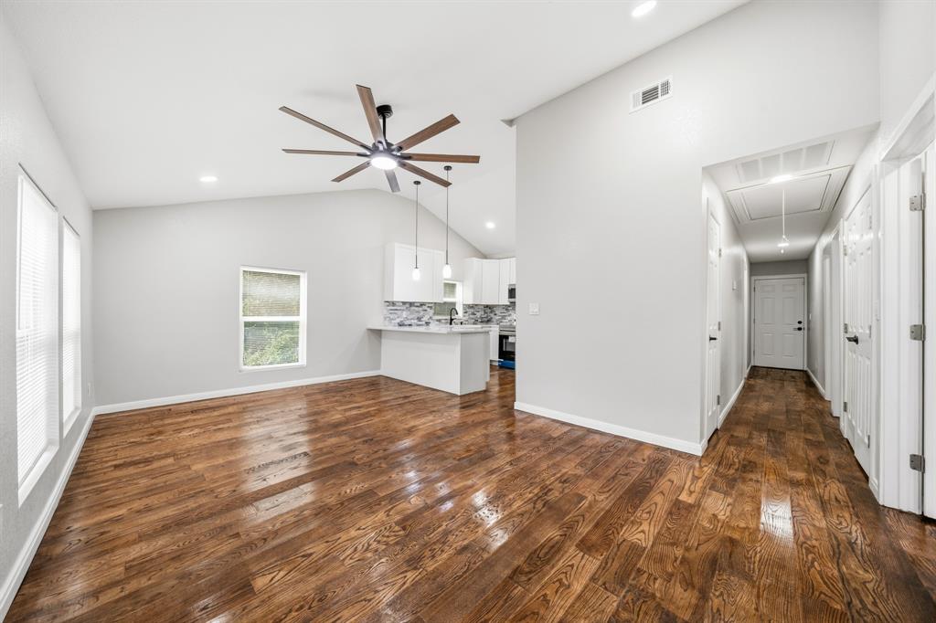 3313 South 3rd Street Waco, TX 76706 - Photo 4 of 28 a view of empty room with wooden floor and ceiling fan