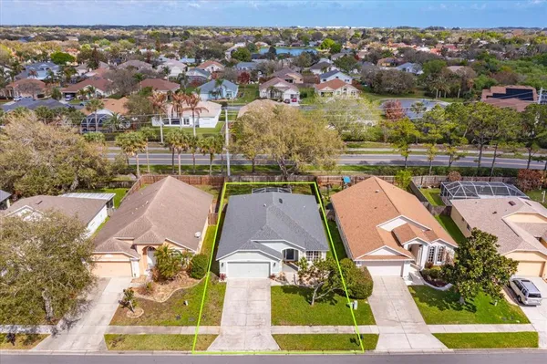 an aerial view of a house with a ocean view
