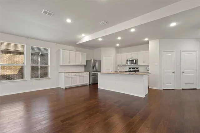 a view of kitchen with wooden floor