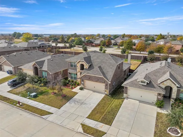 an aerial view of a house with a garden
