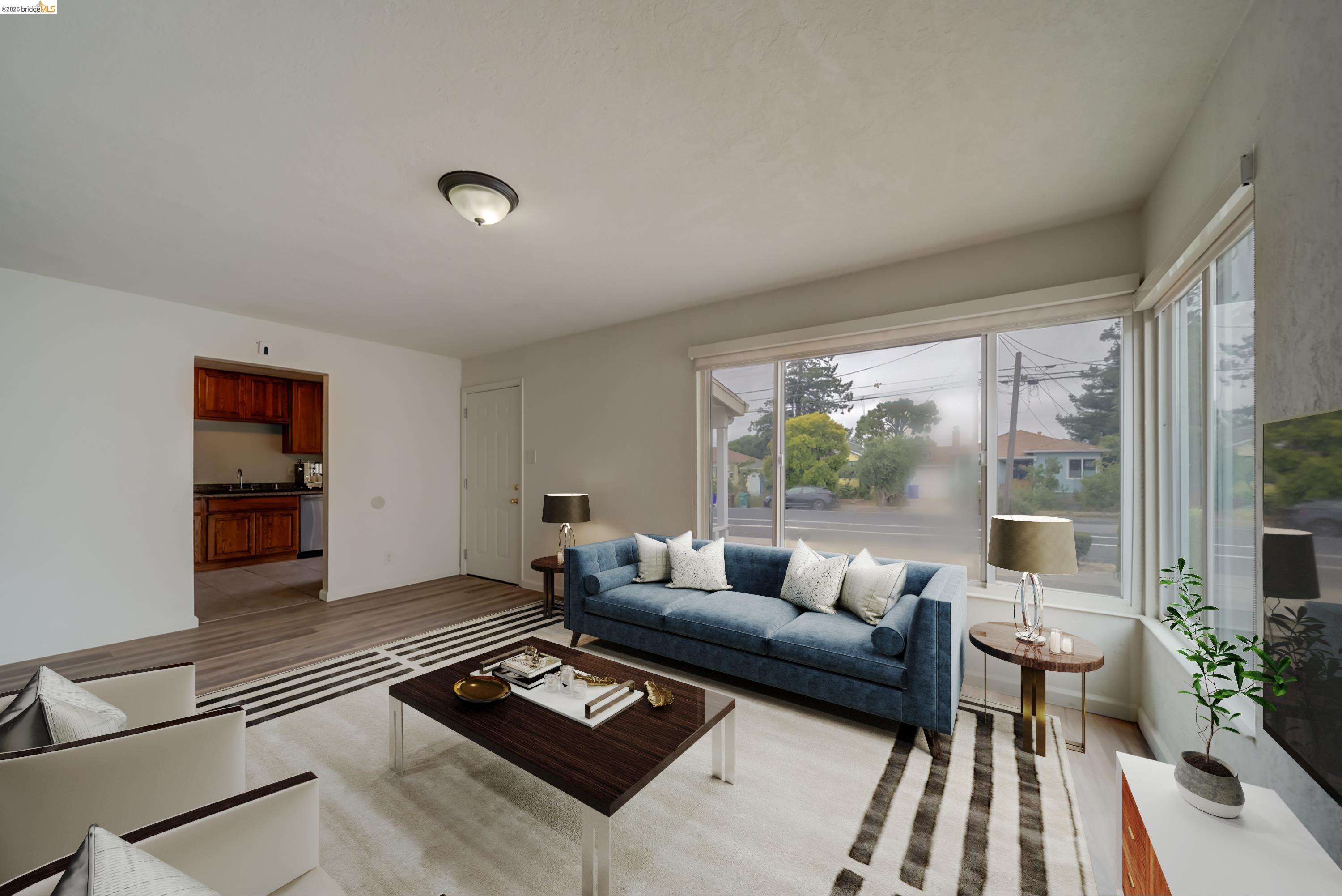 844 37th Street Richmond, CA 94805 - Photo 12 of 35 a living room with furniture and a large window
