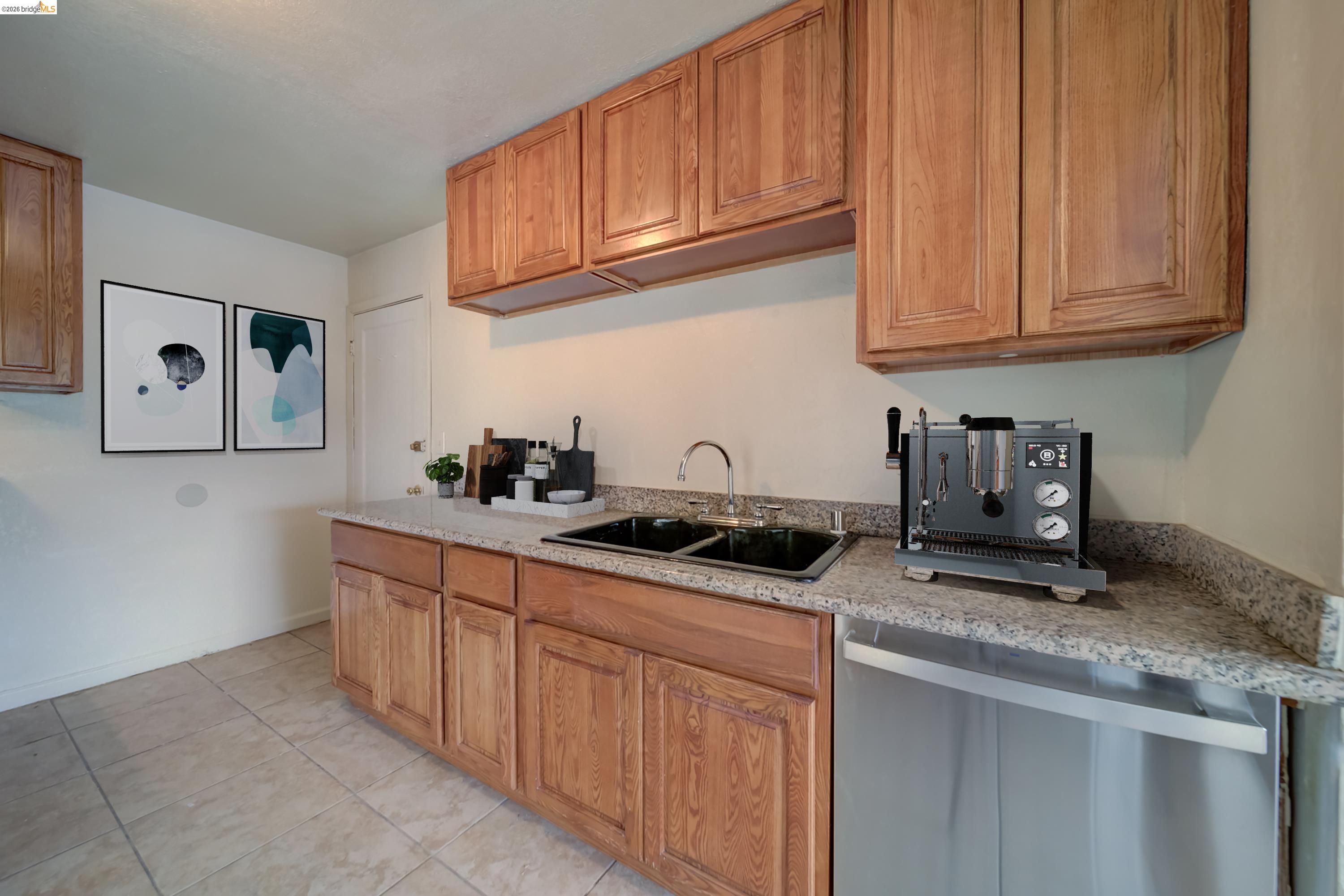 844 37th Street Richmond, CA 94805 - Photo 14 of 35 a kitchen with stainless steel appliances granite countertop a sink stove and cabinets
