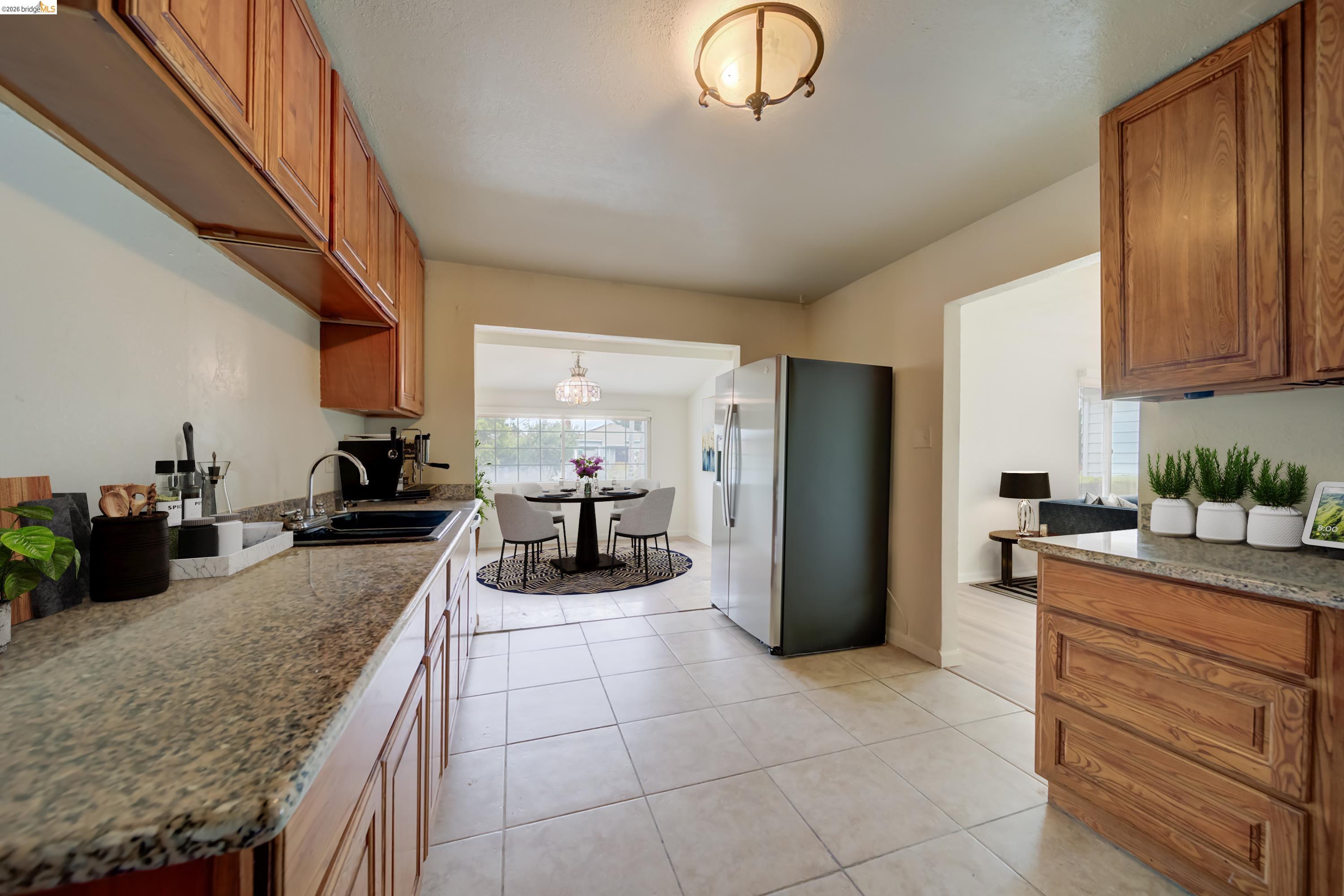 844 37th Street Richmond, CA 94805 - Photo 16 of 35 a kitchen with refrigerator and cabinets