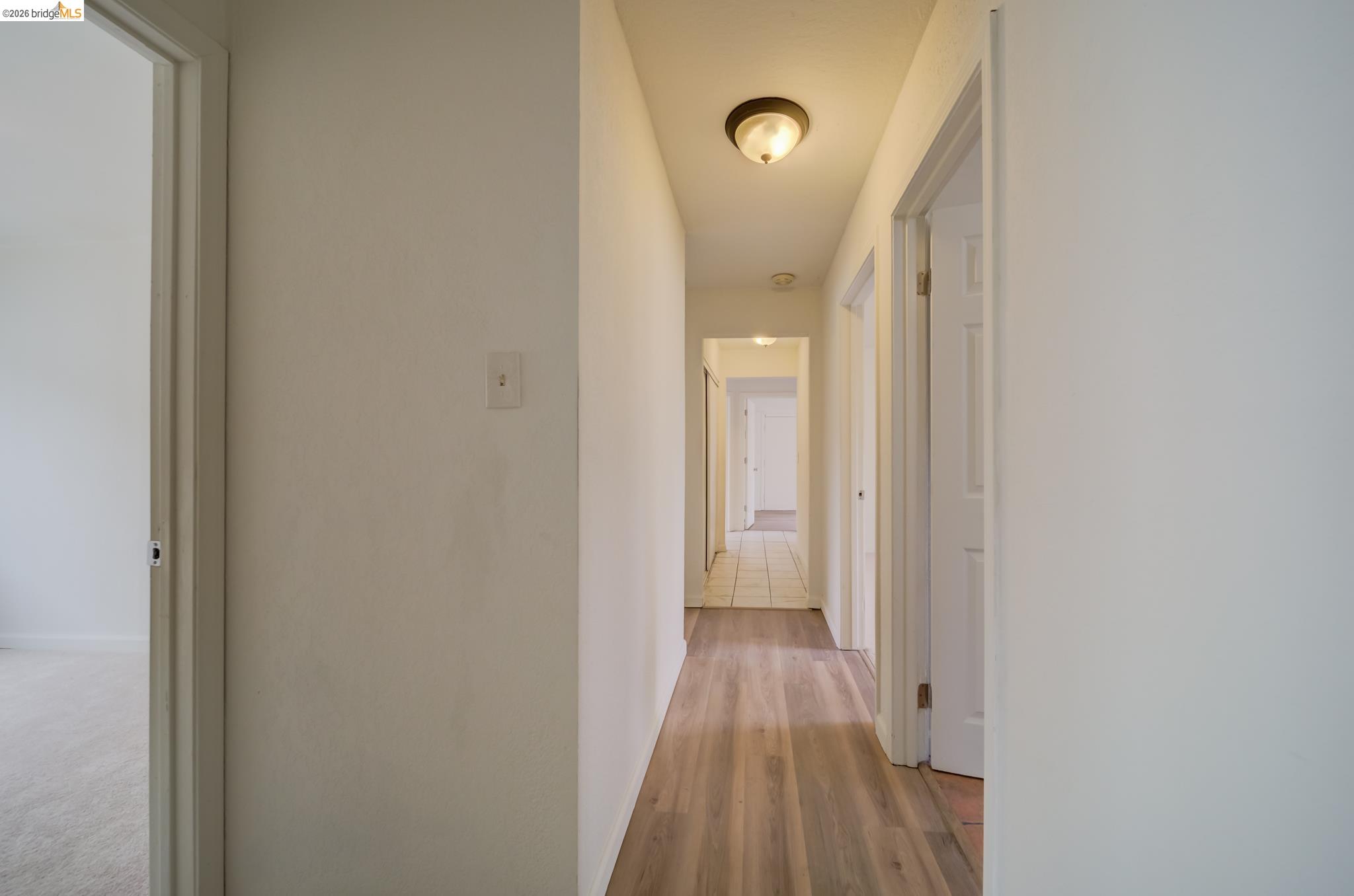 844 37th Street Richmond, CA 94805 - Photo 19 of 35 a view of a room with wooden floor and staircase