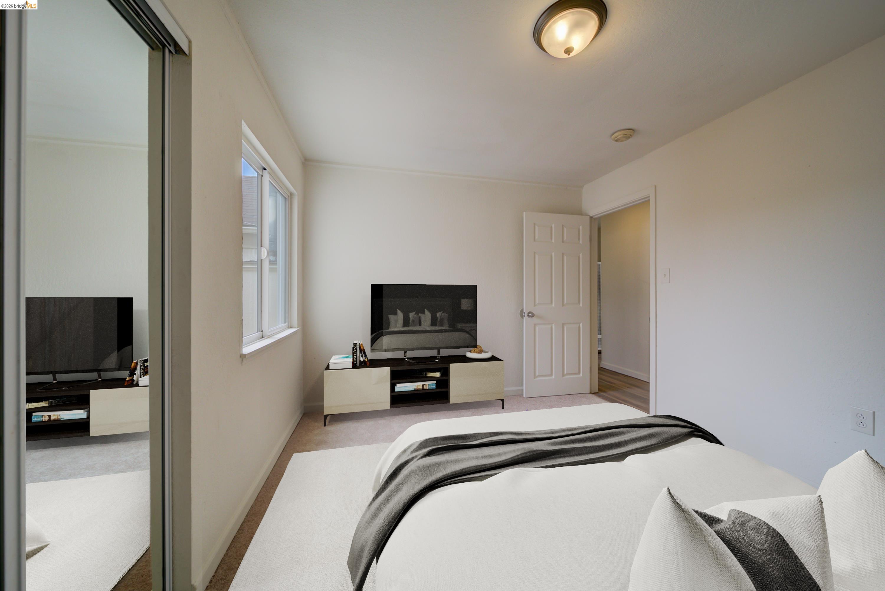 844 37th Street Richmond, CA 94805 - Photo 22 of 35 a living room with furniture and a flat screen tv
