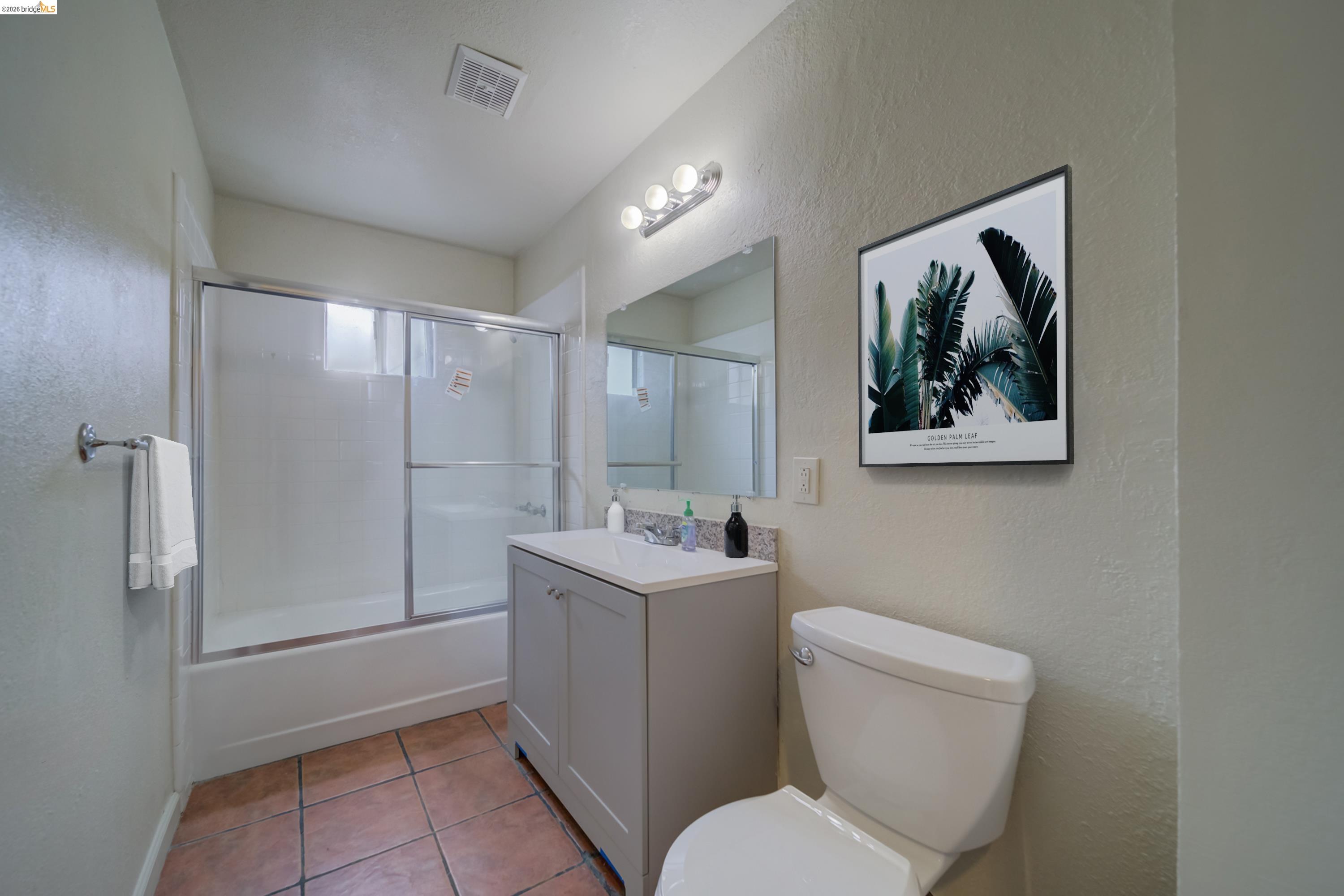 844 37th Street Richmond, CA 94805 - Photo 23 of 35 a bathroom with a toilet sink and mirror
