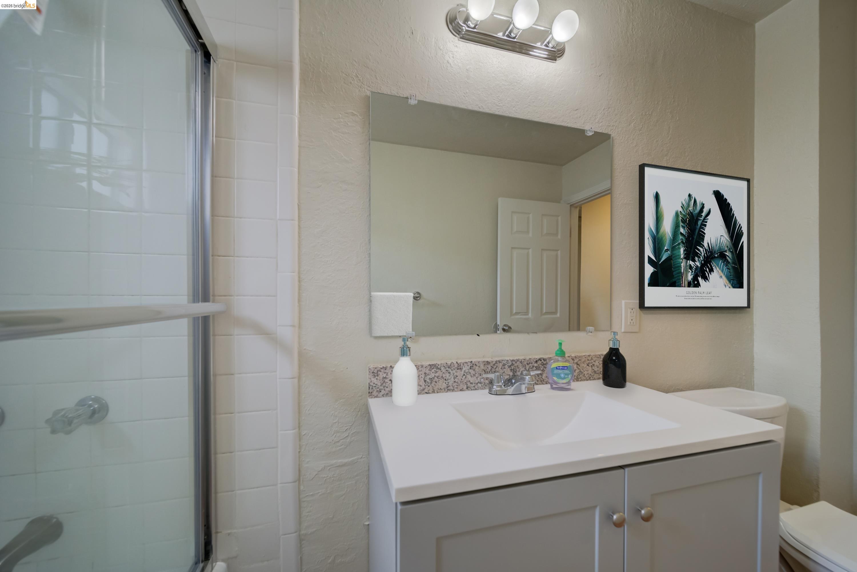 844 37th Street Richmond, CA 94805 - Photo 24 of 35 a bathroom with a sink and a mirror