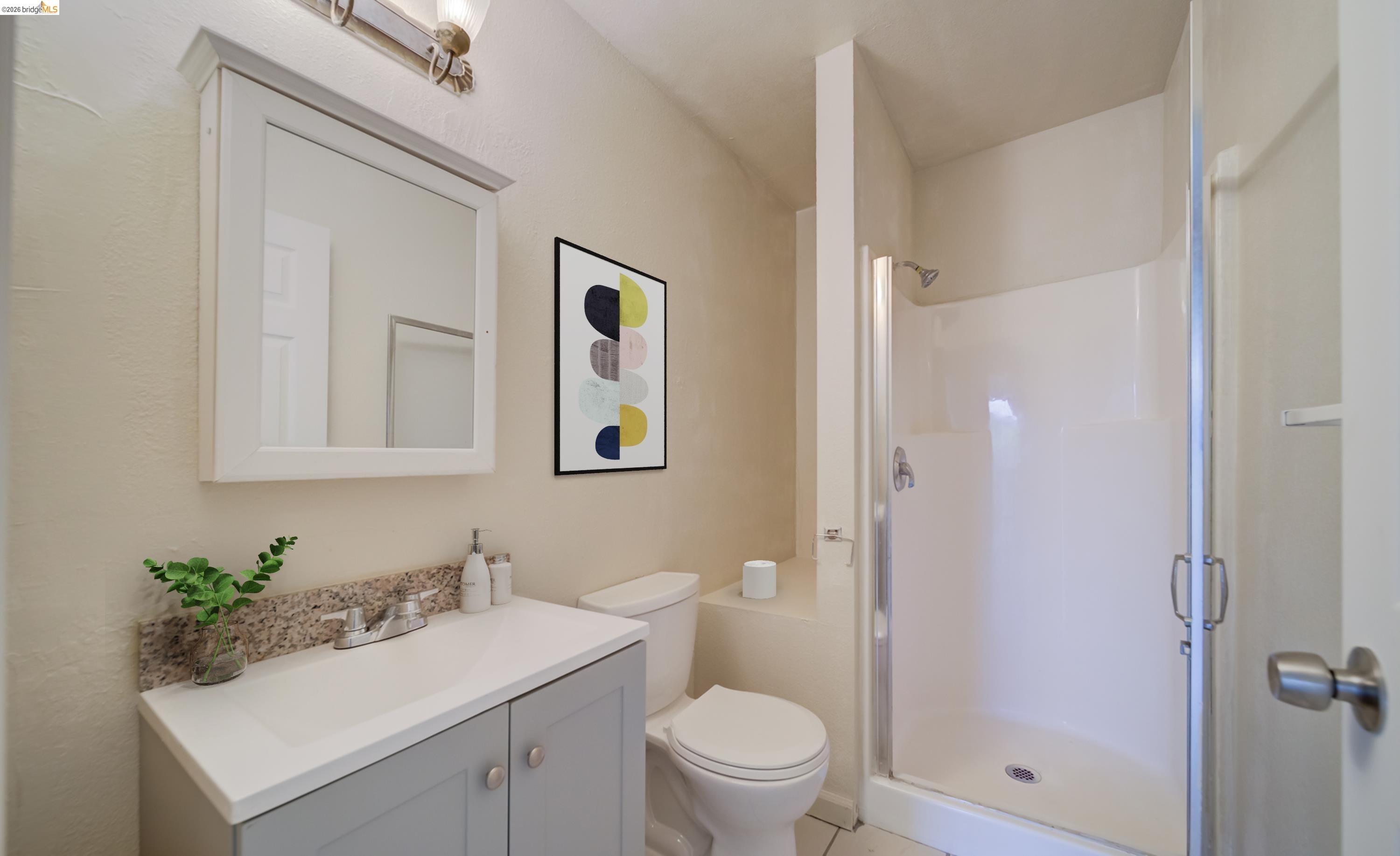 844 37th Street Richmond, CA 94805 - Photo 25 of 35 a bathroom with a sink toilet and shower