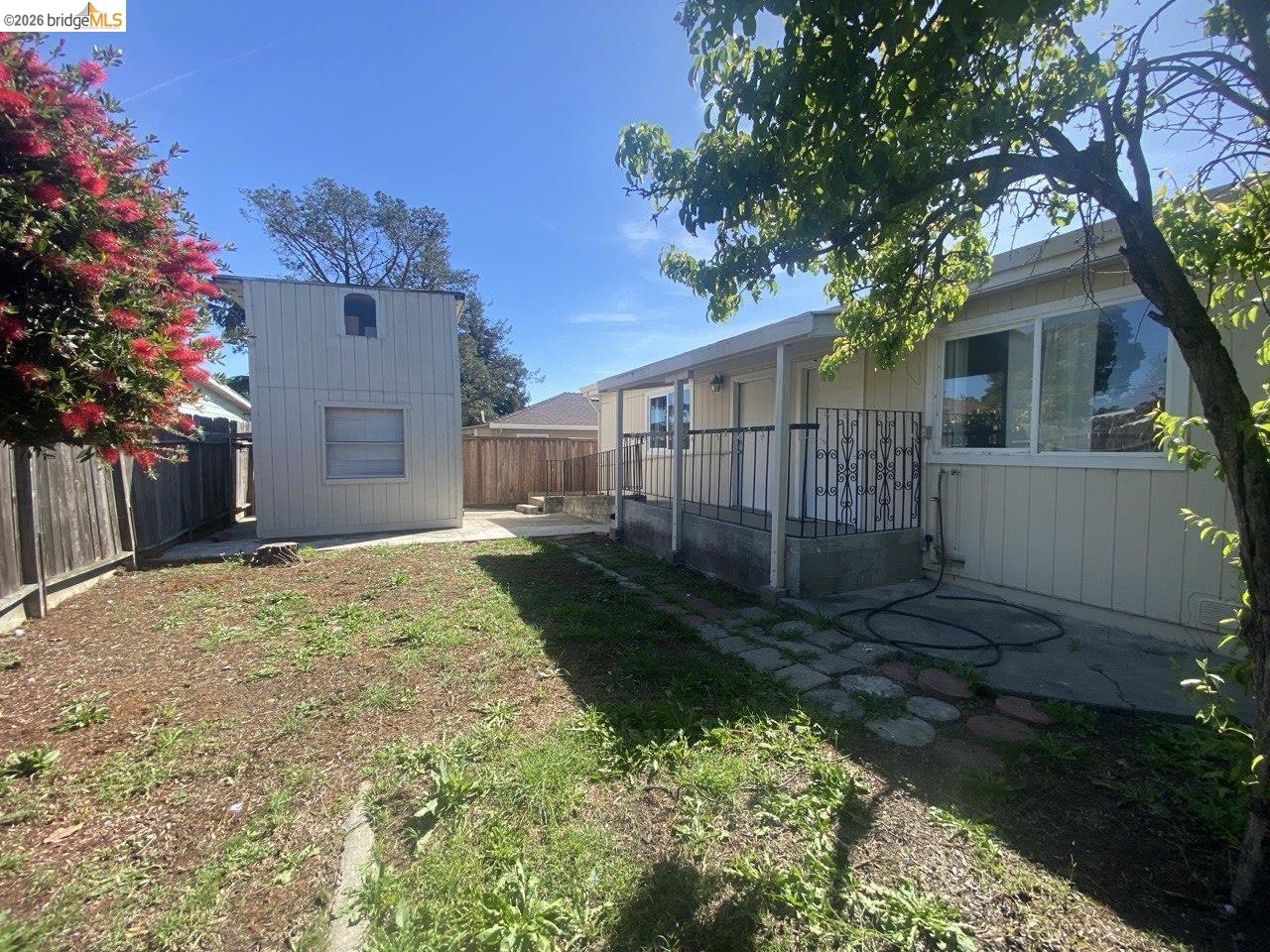 844 37th Street Richmond, CA 94805 - Photo 6 of 35 a view of a yard with a house and a tree
