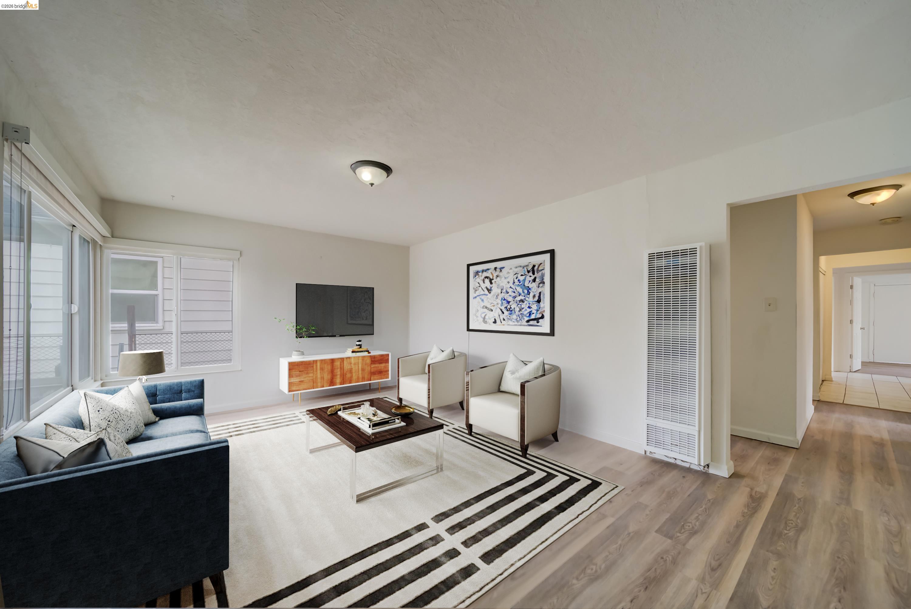 844 37th Street Richmond, CA 94805 - Photo 10 of 35 a living room with furniture and a flat screen tv