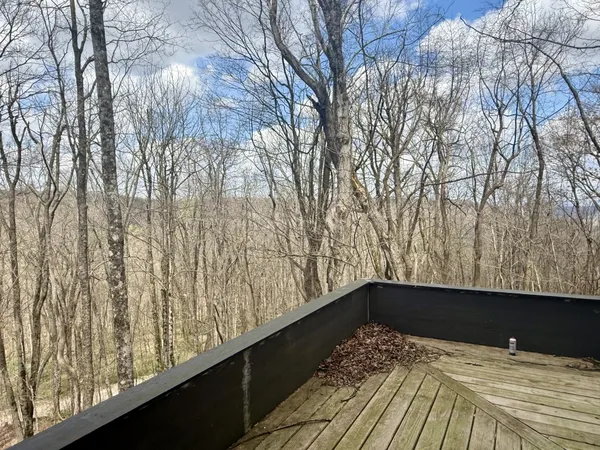 a view of a backyard from a balcony