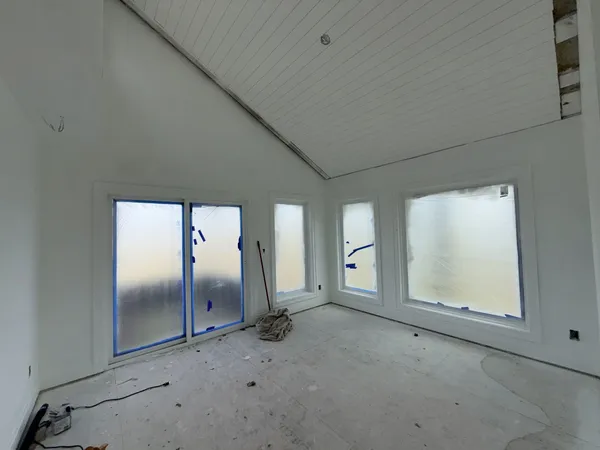 an empty room with windows