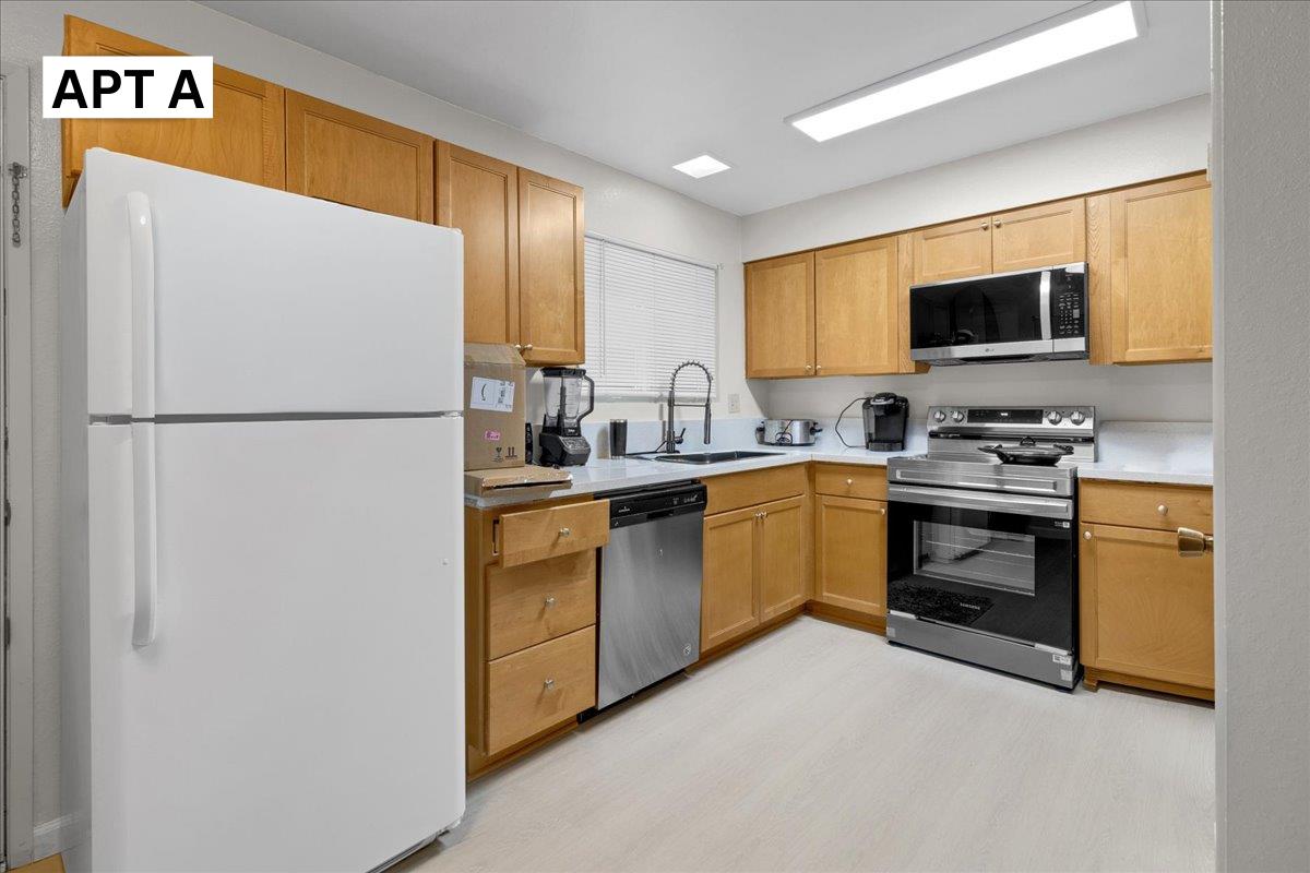 618 Forest Avenue Pacific Grove, CA 93950 - Photo 11 of 78 a kitchen with a refrigerator sink and microwave
