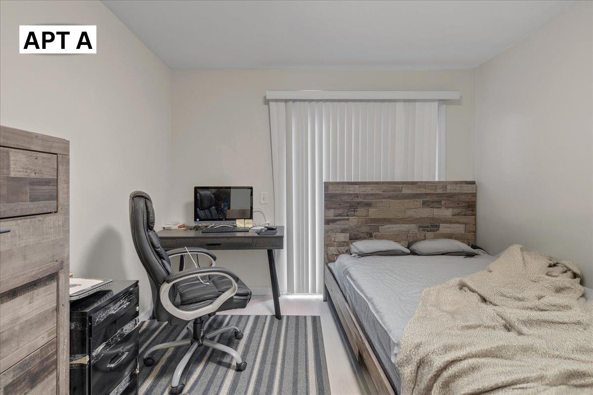 618 Forest Avenue Pacific Grove, CA 93950 - Photo 13 of 78 a bedroom with a bed and a flat screen tv