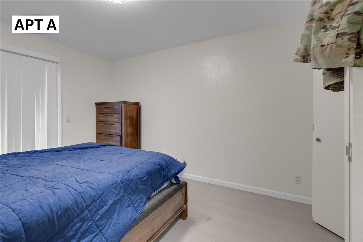 618 Forest Avenue Pacific Grove, CA 93950 - Photo 14 of 78 a bedroom with a bed and a table in it