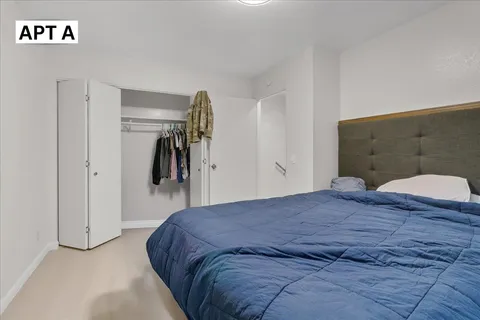 a kitchen with stainless steel appliances a stove microwave and cabinets