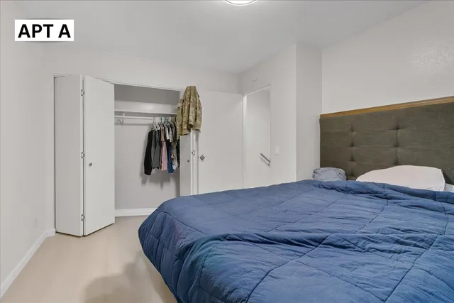 a kitchen with stainless steel appliances a stove a microwave and a refrigerator