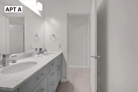 a bathroom with a window and a walk in closet