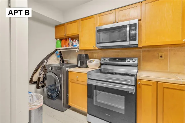 a utility room with dryer and washer