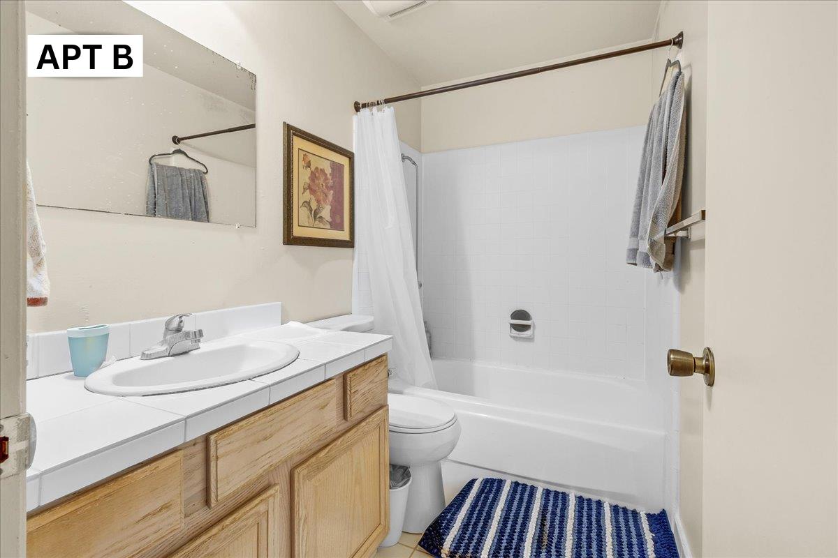 618 Forest Avenue Pacific Grove, CA 93950 - Photo 30 of 78 a bathroom with a sink a toilet and shower