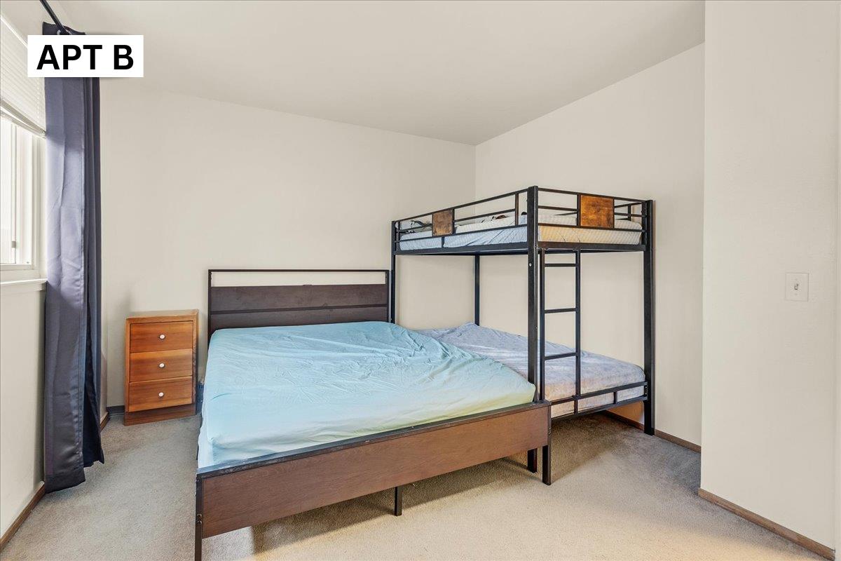 618 Forest Avenue Pacific Grove, CA 93950 - Photo 32 of 78 a bedroom with a bed and a window