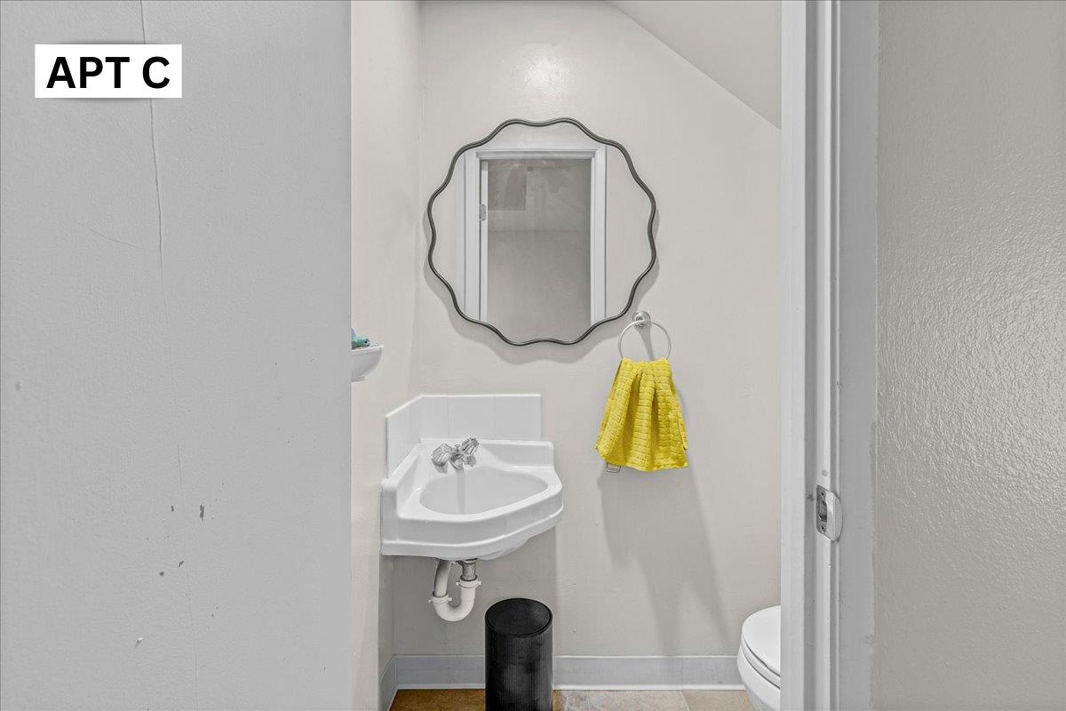 618 Forest Avenue Pacific Grove, CA 93950 - Photo 35 of 78 a bathroom with a sink and mirror