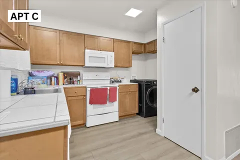 a kitchen with a stove and a refrigerator