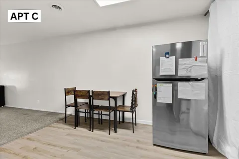 a bedroom with a bed and a night stand