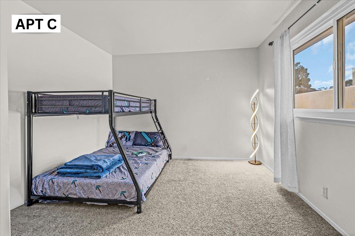 618 Forest Avenue Pacific Grove, CA 93950 - Photo 40 of 78 a bedroom with a bed and a window