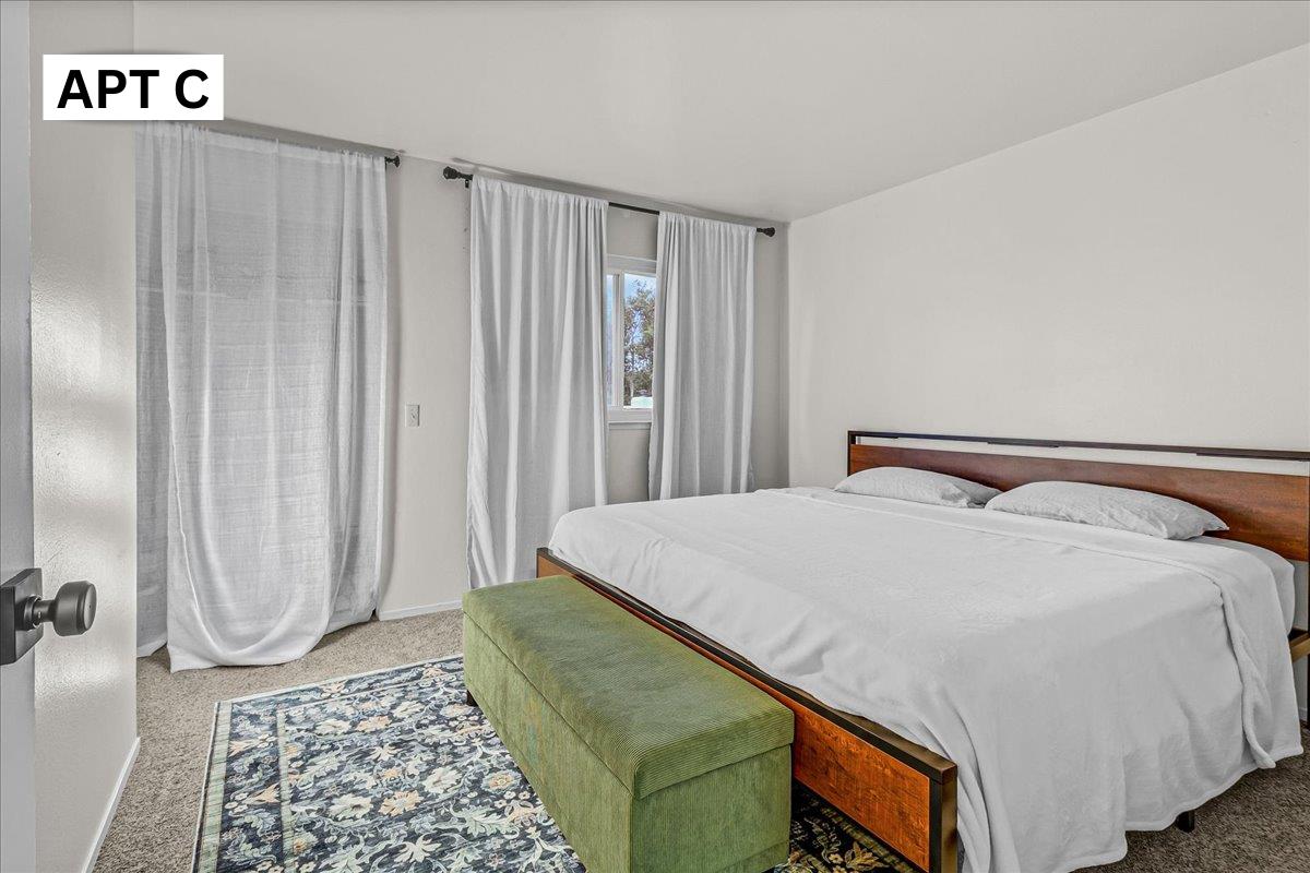 618 Forest Avenue Pacific Grove, CA 93950 - Photo 42 of 78 a bedroom with a bed and a window